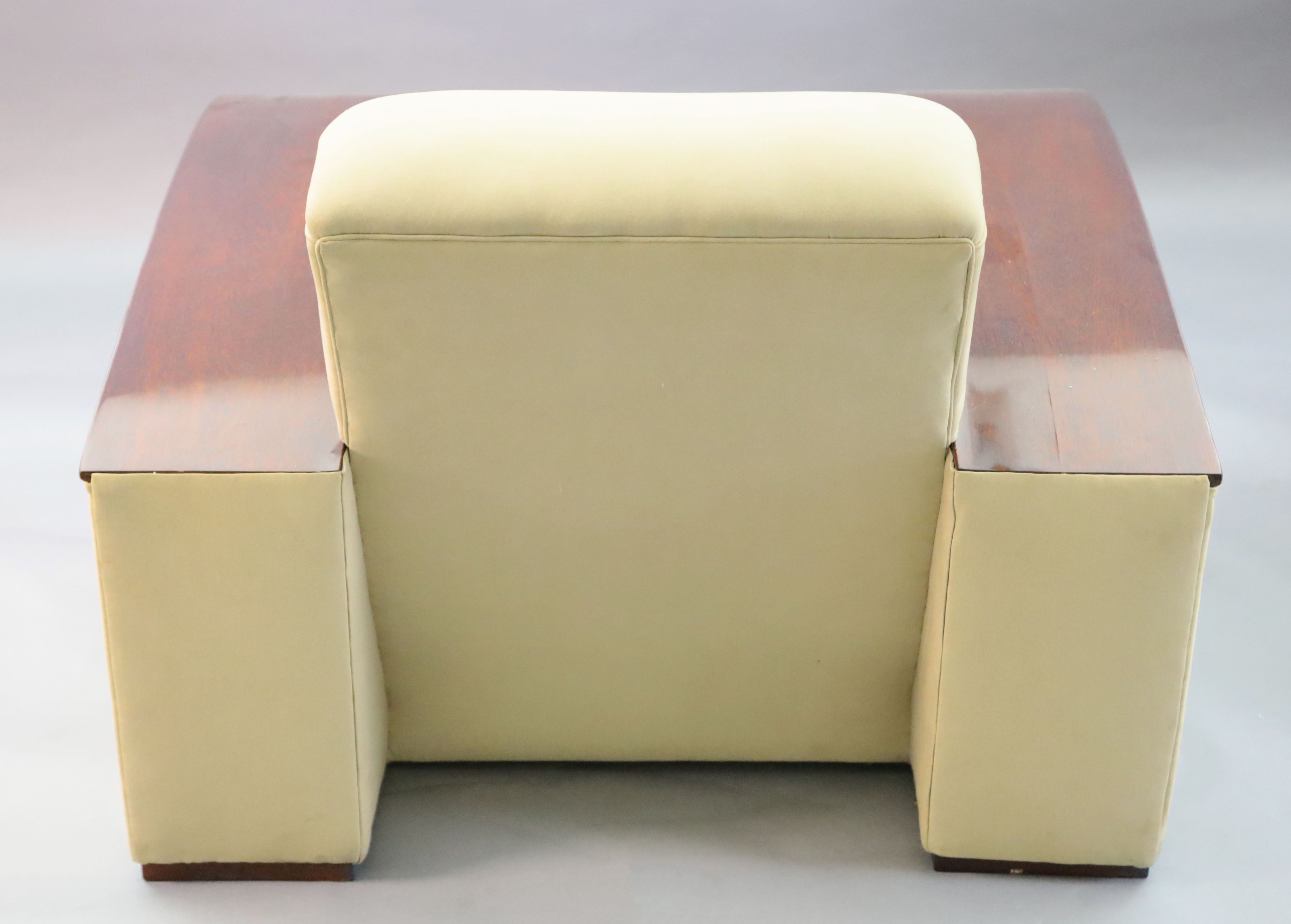 An Art Deco style mahogany and suede three piece suite, settee W.6ft 6in. D.3ft 4in. H.2ft 6in.